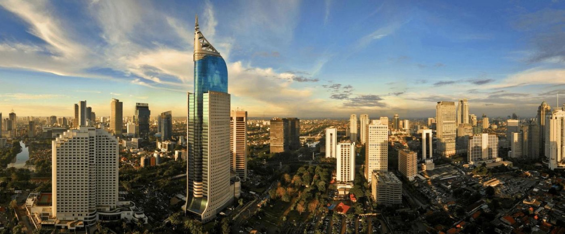 The Jakarta skyline at dusk, towers along Jalan Sudirman